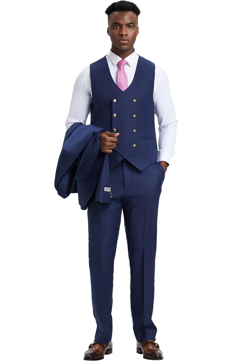 Navy pinstripe Stacy Adams one-button suit. Double-breasted vest with gold buttons, side peak lapel. Matching trousers. Jacket held in model's left arm.
