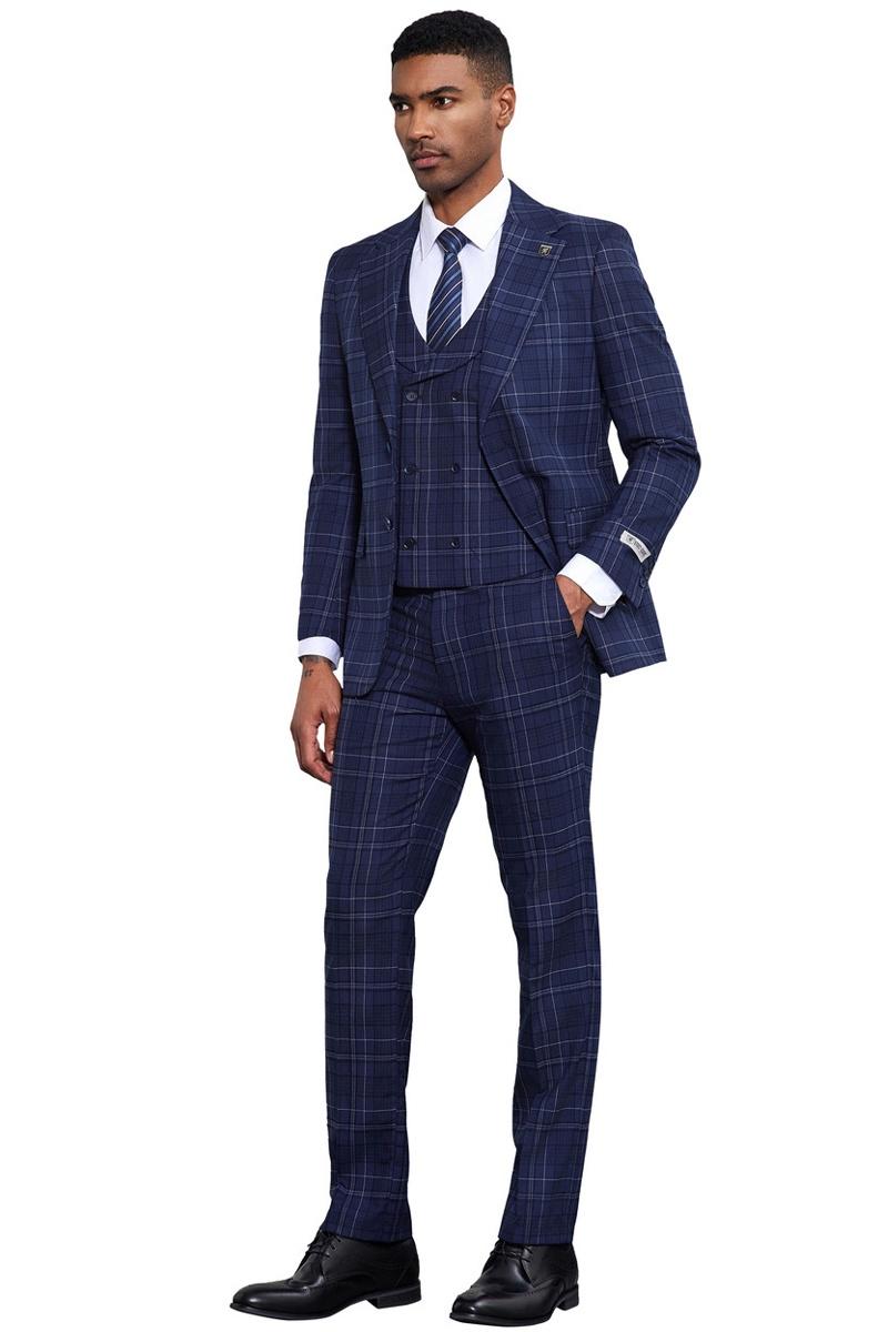 Navy Stacy Adams vested suit. Tailored fit, double windowpane plaid. Includes blazer, trousers, and vest. Blazer: notched lapels, front pockets. Trousers: tapered ankle. Classic, structured design.
