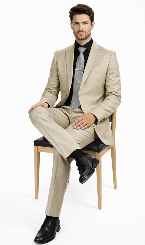 Italian Albertonardoni beige suit: fitted blazer, notched lapels, two-button closure, matching trousers. Lightweight, smooth fabric. Paired with a black shirt, patterned tie, and black shoes.
