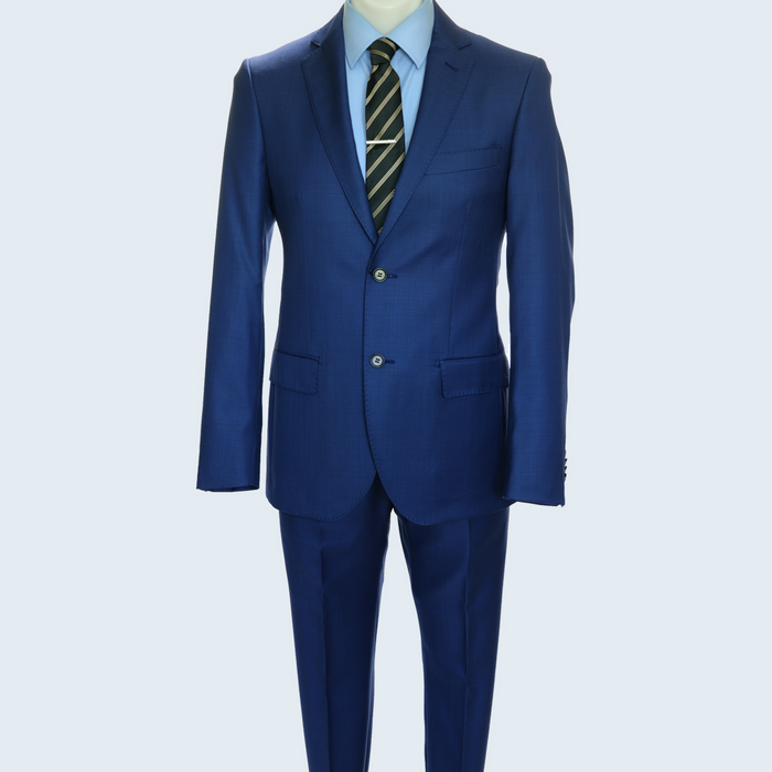 Italian-made Galante Uomo suit by Albertonardoni. Tailored fit, vibrant blue textured fabric, two-button closure. Includes matching trousers. Paired with a light blue shirt and striped tie.
