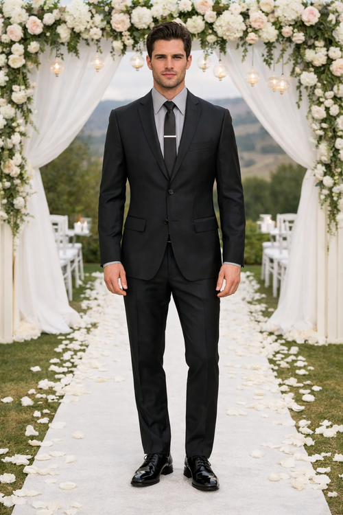 Albertonardoni Galante Uomo Italian wool black suit. Tailored fit, single-breasted jacket with notch lapels, two-button closure. Flat-front trousers. Smooth, matte finish. Includes black tie and shirt. Monochromatic.
