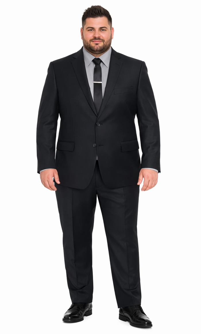 Italian-made Albertonardoni black suit. Tailored, structured wool. Single-breasted jacket, straight-leg trousers. Classic black, sleek silhouette. Worn with a gray shirt and black tie.
