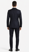 Italian black wool suit with a fitted silhouette. Jacket: single rear vent, two side pockets. Trousers: tailored, tapering fit.

