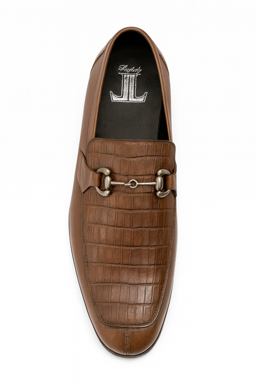Men's brown slip-ons with croc-textured upper, metallic bit detail, and rounded toe. Black lining, flat, robust sole. Slightly elevated heel.
