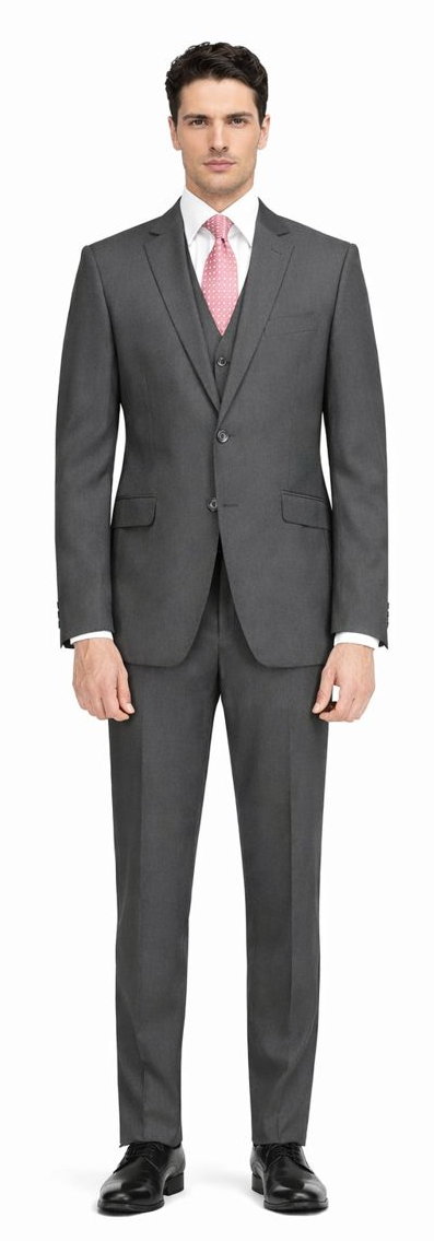 Giorgio Fiorelli charcoal gray suit: tailored jacket (notched lapel, 2-button closure, pockets) & matching straight-leg trousers. Includes light gray shirt & pink dotted tie.