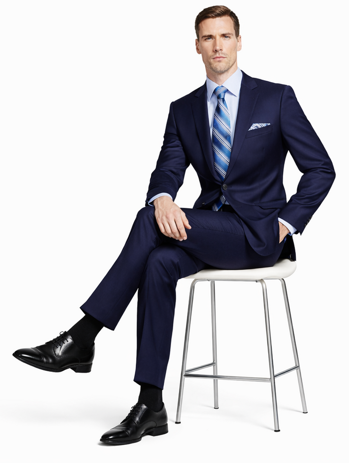 Giorgio Fiorelli navy/gray two-button suit: tailored fit, structured silhouette. Navy jacket with gray accent, breast pocket. Straight-leg navy trousers. Light blue shirt, striped tie. Black leather shoes.
