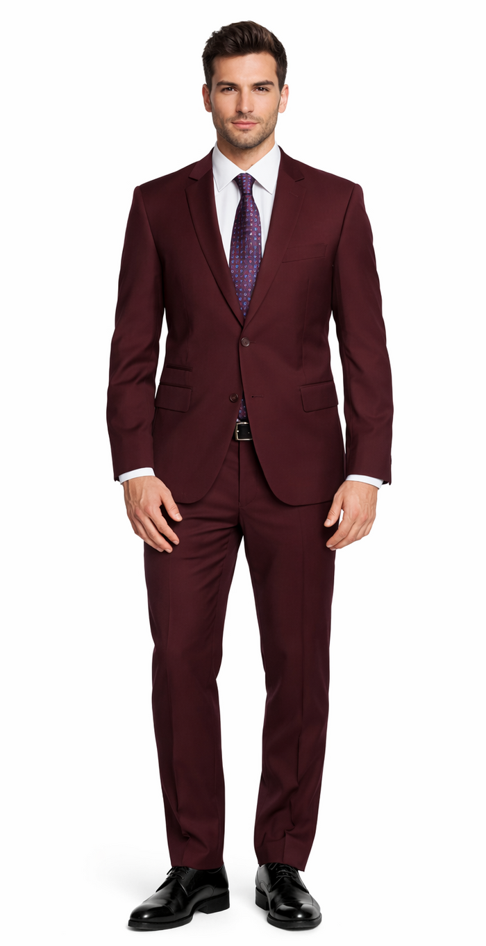 Burgundy Giorgio Fiorelli suit: structured, two-button jacket with notch lapels, straight-fit trousers. Worn with a white shirt, patterned tie, and black shoes for a polished look.
