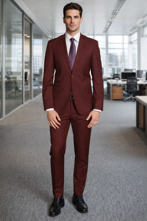 Giorgio Fiorelli burgundy suit: tailored fit, two-button jacket with notched lapel and pockets. Straight-leg trousers. Smooth, slightly shiny fabric.
