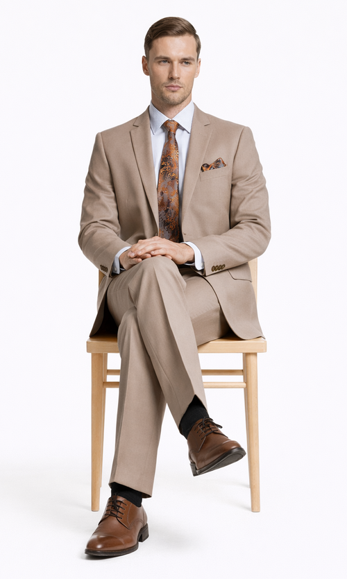 Burgundy camel beige two-button suit with tailored blazer, matching pants, and smooth fabric. Notch lapels, patterned pocket square. Model wears striped light blue shirt.
