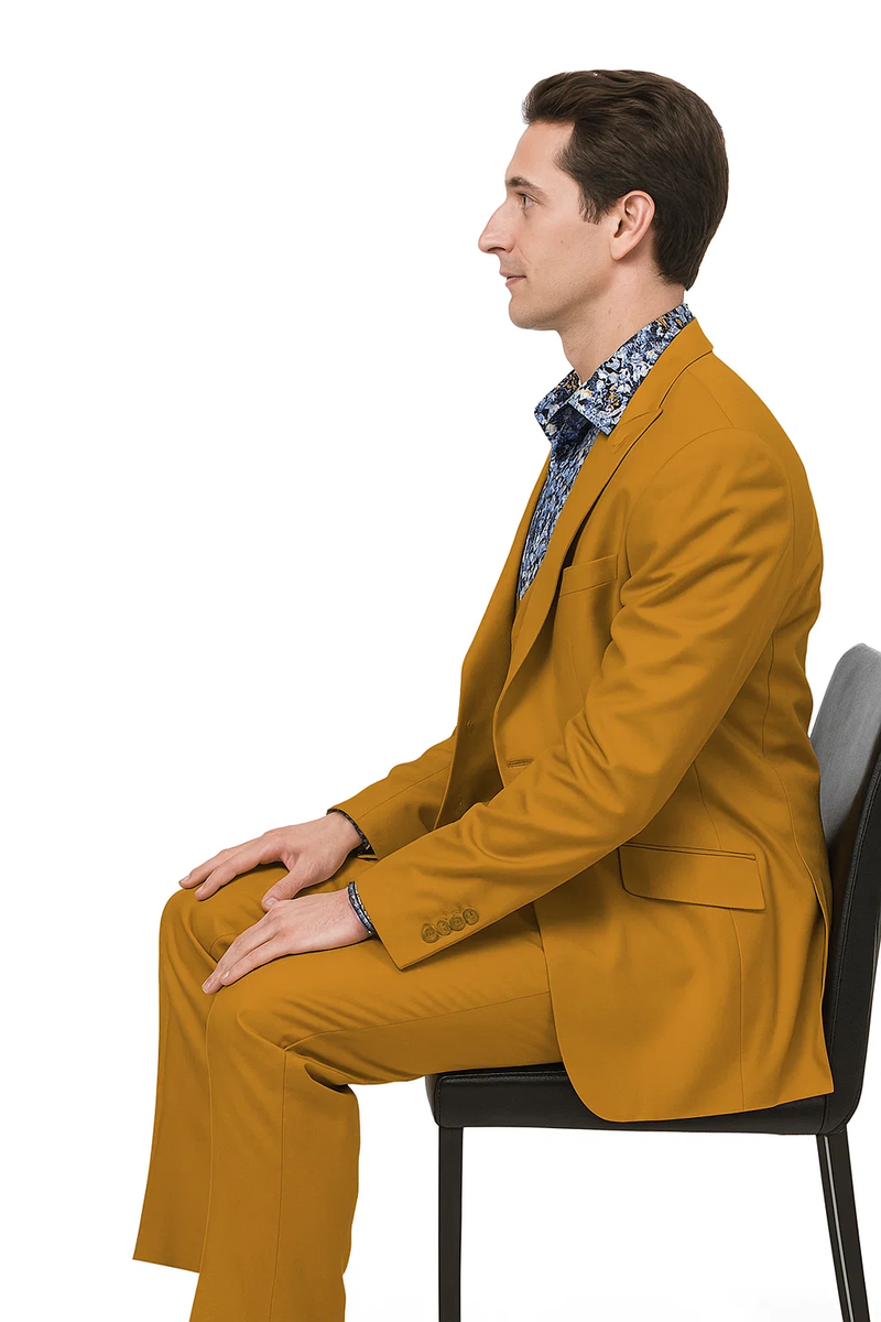 Gold men's suit: double-breasted vest, two-button peak lapel, straight-fit. Smooth, uniform gold fabric. Jacket: side pockets, single back vent. Trousers: straight-cut, matching gold.
