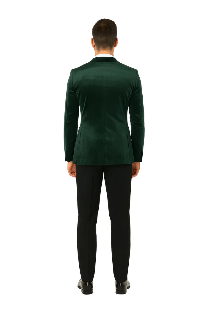 Green velvet double-breasted tuxedo jacket. Tailored fit, structured shoulders, smooth silhouette. Rich green velvet for a luxurious look. Peak lapel, classic design. Sleek, unembellished back for formality.
