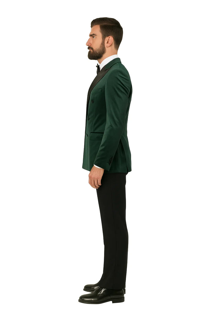 Green velvet double-breasted tuxedo jacket. Fitted silhouette with rounded lapels and two front pockets. Soft, textured fabric in a rich, deep green.
