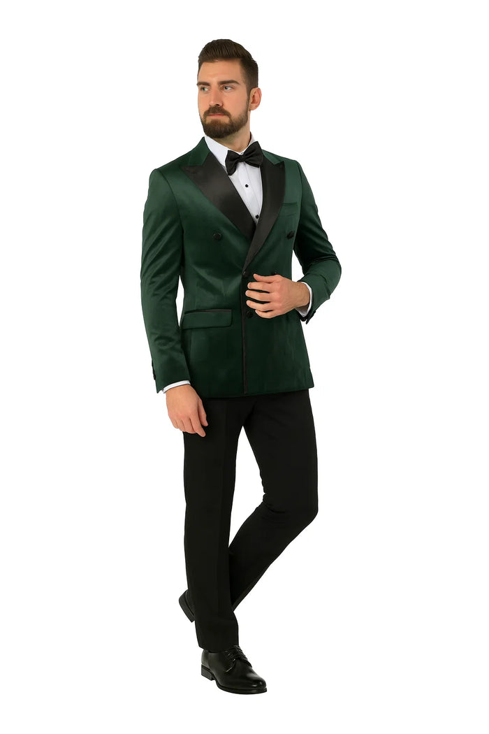Green velvet double-breasted tuxedo jacket. Smooth, plush material in rich green. Wide lapels, two rows of buttons, fitted silhouette. Black satin lapels offer contrast and a distinctive design.
