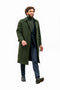Olive wool overcoat: long, straight cut, button front, notch lapels. Paired with dark blue trousers and black leather boots. Business casual winter ensemble with structured design.
