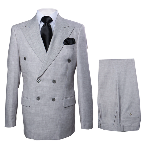 Grey double-breasted suit jacket (100% wool) with sharp lapels, two buttons. Paired with matching baggy, pleated wide-leg pants. Relaxed silhouette, single hem button.