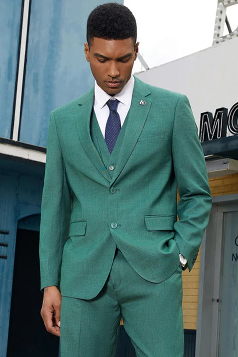 Stacy Adams neon teal suit for men. Two-button blazer with vest, classic fit, and side pockets. Subtle textured fabric in solid color.
