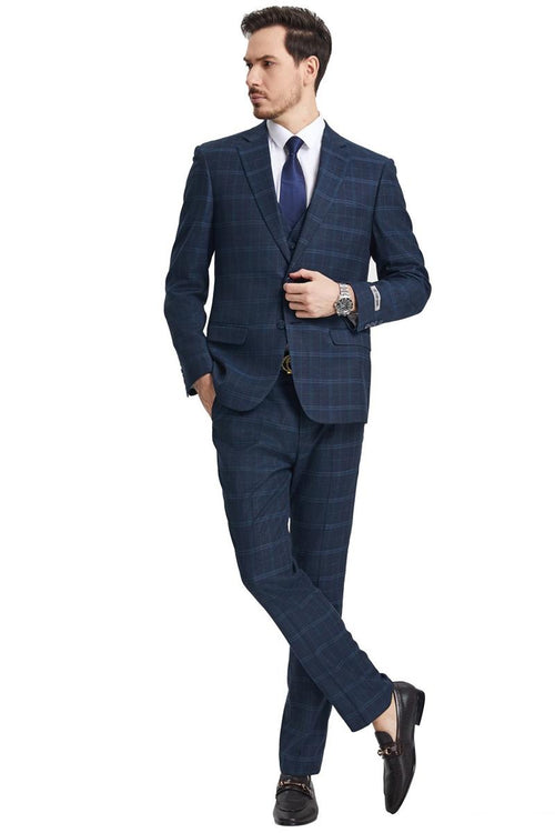 Men's Stacy Adams vested modern fit suit features a navy blue fabric with a windowpane plaid pattern. The suit includes a notch lapel jacket, fitted trousers, and a three-piece design.