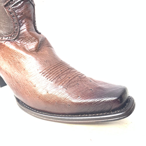 Brown ostrich quill leather boots with a textured surface and subtle patterning. Pointed toe and slightly raised, stacked heel.
