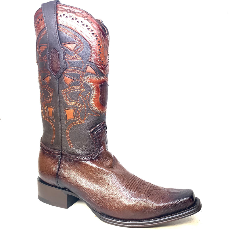Brown Los Altos cowboy boots with smooth ostrich quill leather. Multicolored, patterned stitching on the shaft. Pointed toe, medium stacked heel. Seamless shaft-vamp transition.
