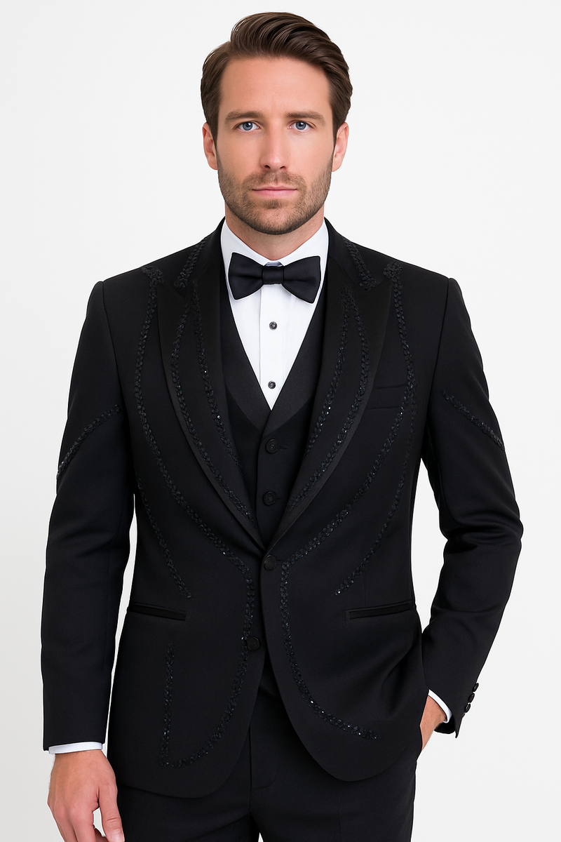 Modern fit, 3-piece Italian black wool tuxedo. Tailored jacket with shawl collar and beaded accents. Slim-fit trousers and matching vest.