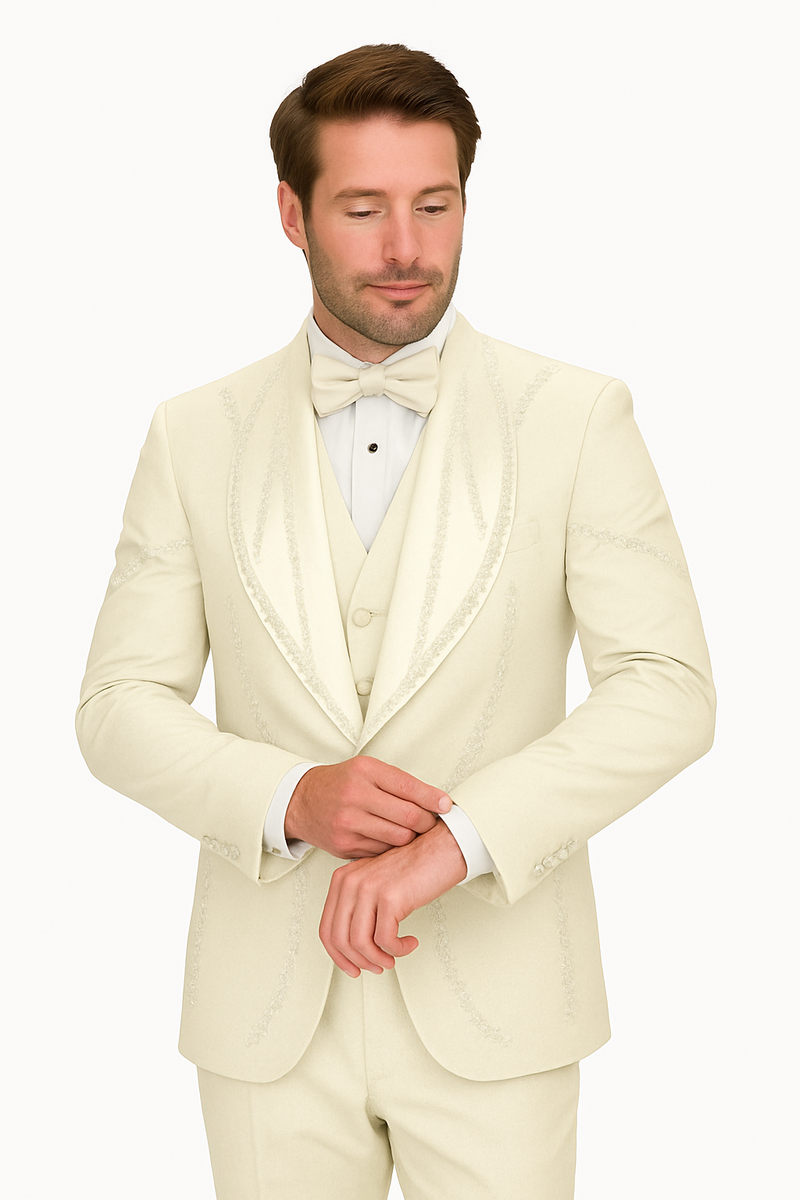 Off-white Italian wool tuxedo. Modern fit, three-piece: single-breasted jacket with peak lapels, waistcoat, and trousers. Subtle decorative stitching. Smooth, tailored fabric with structured fit. Buttoned front.
