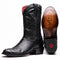 Black python cowboy boots by Marco Di Milano. Round toe, red interior, smooth leather sole. Textured black python upper, stacked heel, tonal stitching.

