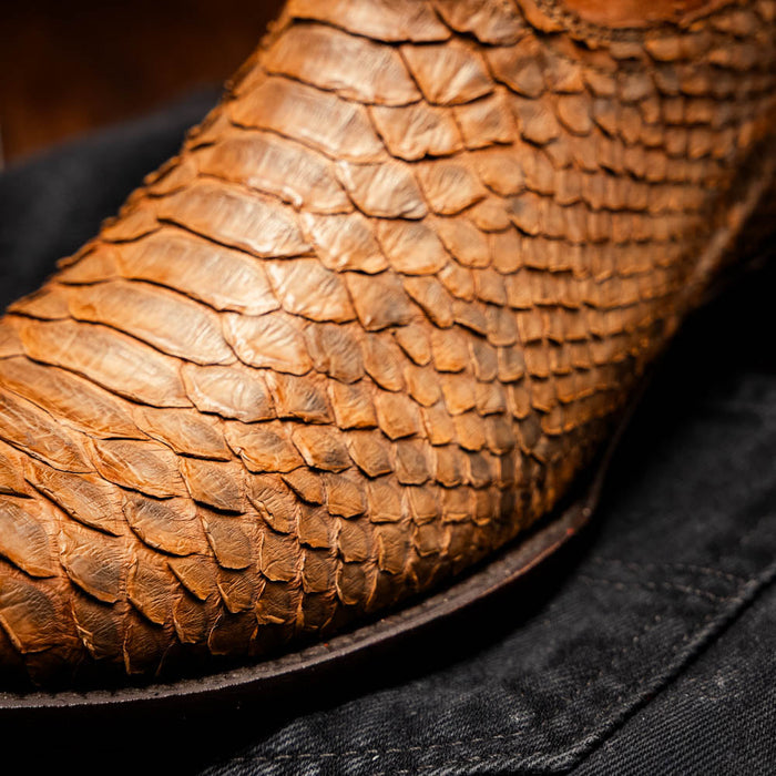 Marco Di Milano Kansas cowboy boots. Cognac, textured, scaled leather upper. Round toe. Dark, contrasting sole. Classic Western style.

