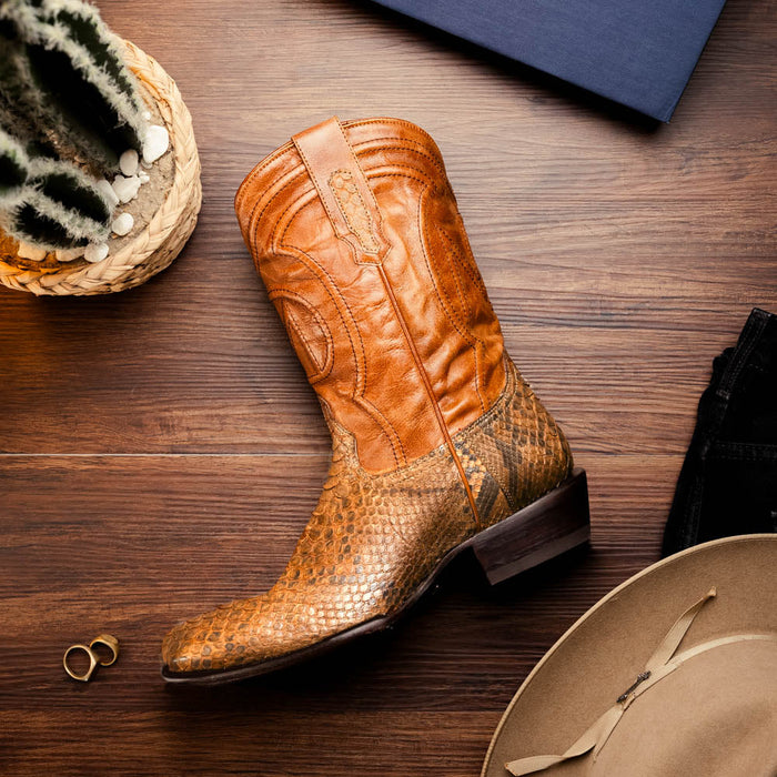 Marco Di Milano Kansas cowboy boots. Cognac, round-toe, polished tan leather upper with a textured, golden-brown reptile pattern. Stacked heel, decorative stitching, and contrasting textures. Metallic sheen.
