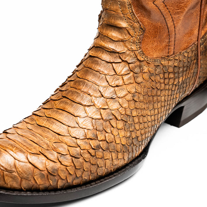 Marco Di Milano Kansas Cognac cowboy boots. Round toe, textured snake-like pattern in cognac leather. Features a smooth brown section and a structured, darker heel.
