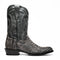 Black leather cowboy boots with round toe. White stitching and embossed details adorn the upper. Lower section features dark snakeskin texture. Slightly curved stacked heel.
