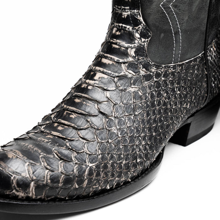 Marco Di Milano Kansas Stone boots: White, round toe, cowboy style. Textured black reptilian-pattern leather upper. Low, stacked heel and smooth toe finish.
