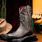 Marco Di Milano Kansas Stone White cowboy boots with round toe, reptilian-look synthetic finish, decorative stitching, embossed design, black leather shaft, red lining, and a structured sole.
