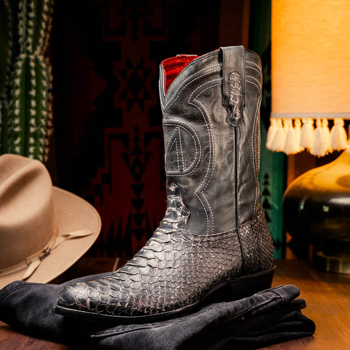 Marco Di Milano Kansas Stone White cowboy boots with round toe, reptilian-look synthetic finish, decorative stitching, embossed design, black leather shaft, red lining, and a structured sole.
