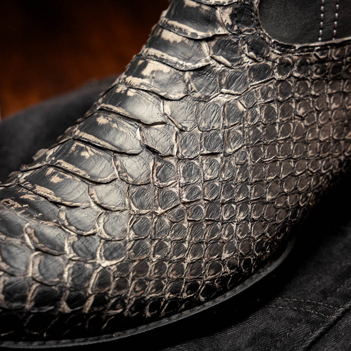 Marco Di Milano Kansas Stone White cowboy boots with round toe. Textured white/gray reptile-like surface. Black stitching adds structured design.
