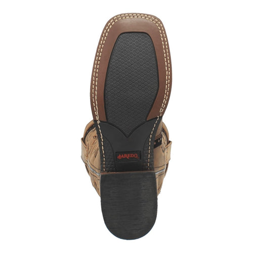 Honey-colored Laredo women's boots, bottom view. Textured black rubber sole with brown leather edge. Visible stitching and red "Laredo" logo. Square toe, classic western style.
