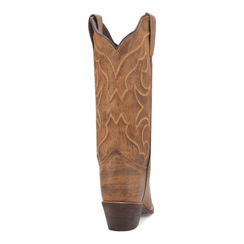Laredo Reva snip toe boots in honey leather. Tall shaft with stitched pattern, slight heel, and pointed toe. Western aesthetic.
