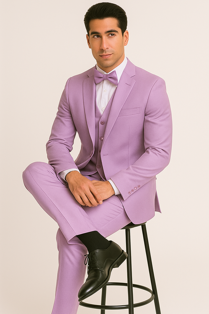 Lavender Majesty tuxedo: Tailored jacket, vest & slim-fit trousers in lavender. Includes a white shirt & lavender bow tie. Single-breasted jacket, four-button vest, & black dress shoes.
