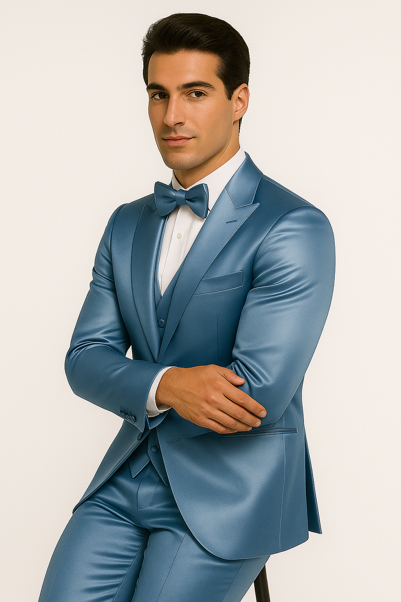 Light blue Alberto Nardoni tuxedo set. Single-breasted jacket with matching bow tie, tailored trousers, and waistcoat. Smooth, shiny fabric for a cohesive, formal look.
