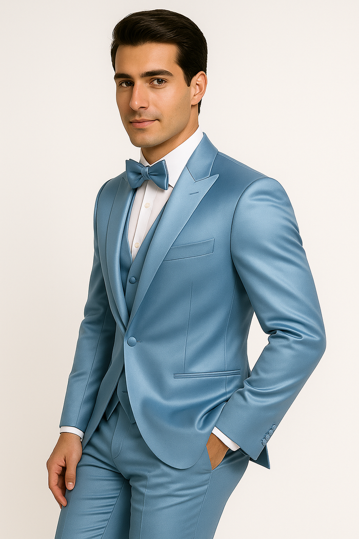 Light blue tuxedo set: fitted jacket, matching vest, and tailored trousers. Includes a bow tie. Sleek, contemporary design with structured lapels and pocket detailing. Uniform light blue color.
