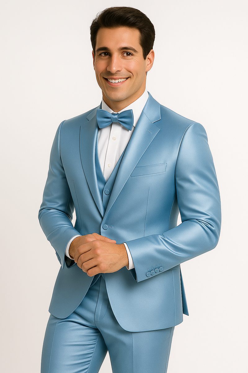 Light blue Majesty tuxedo set: four-piece formal ensemble. Features a fitted jacket (notch lapels), waistcoat, slim-fit trousers, and bow tie. Smooth, glossy fabric in uniform light blue. Modern, elegant design.
