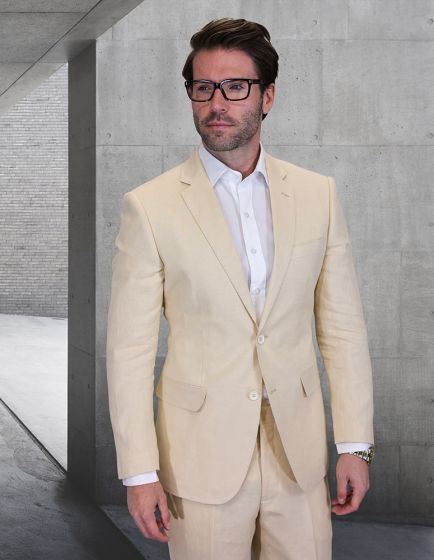 The Statement men's 2-piece modern fit suit is made from 100% linen, featuring a light beige color. It includes a single-breasted jacket with notch lapels and two front pockets. The matching trousers have a straight leg design and a flat front.