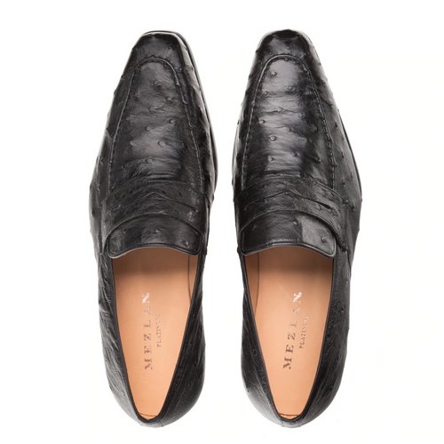 Mezlan Lisbon black ostrich quill penny loafers. Elongated silhouette, slightly pointed toe, textured ostrich leather. Penny strap. Tan lining. Leather sole.
