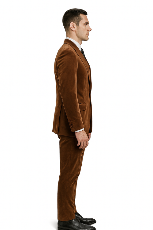 Men's rust copper brown velvet 2-piece suit. Slim-fit blazer with notched collar, single-button closure, and a structured silhouette. Matching straight-leg pants. Tailored, formal style with a smooth, soft texture.