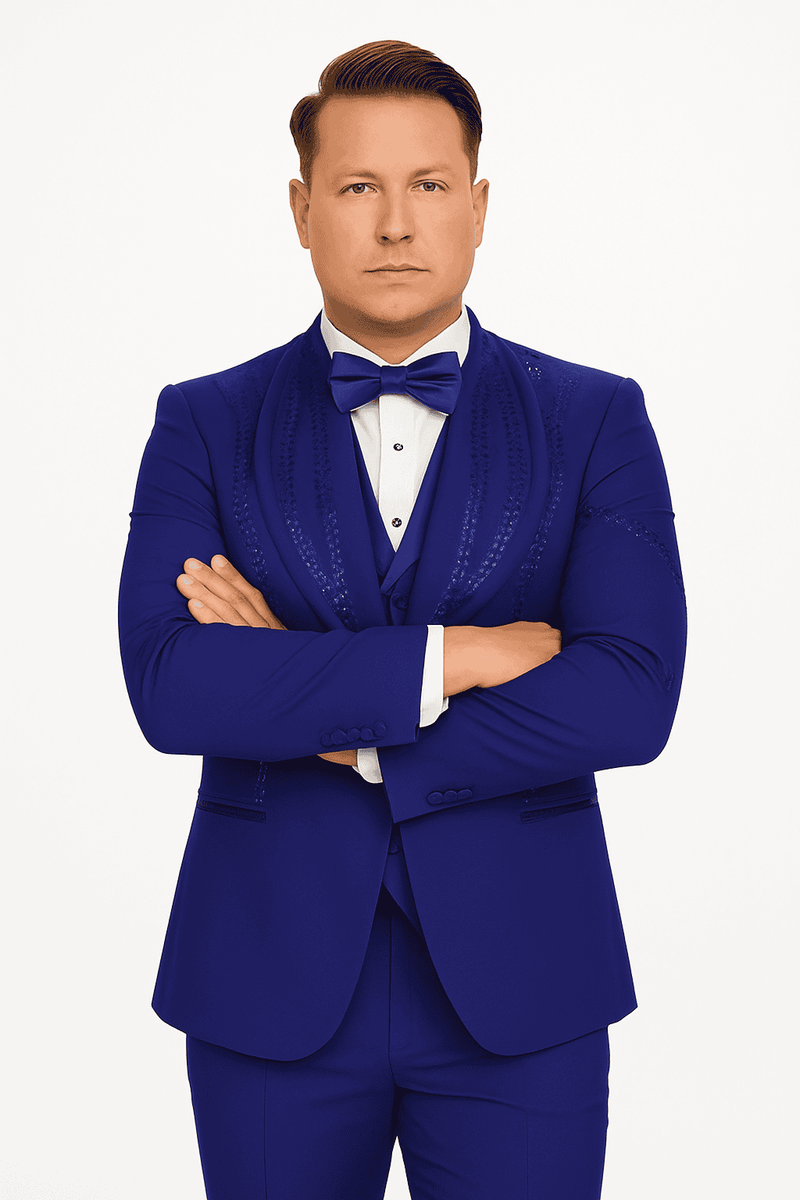 Royal blue Alberto Nardoni tuxedo. Three-piece suit in Italian wool, modern slim fit. Features jacket (narrow lapels, decorative stitching), trousers, and waistcoat. Streamlined, tailored design. Includes bow tie.
