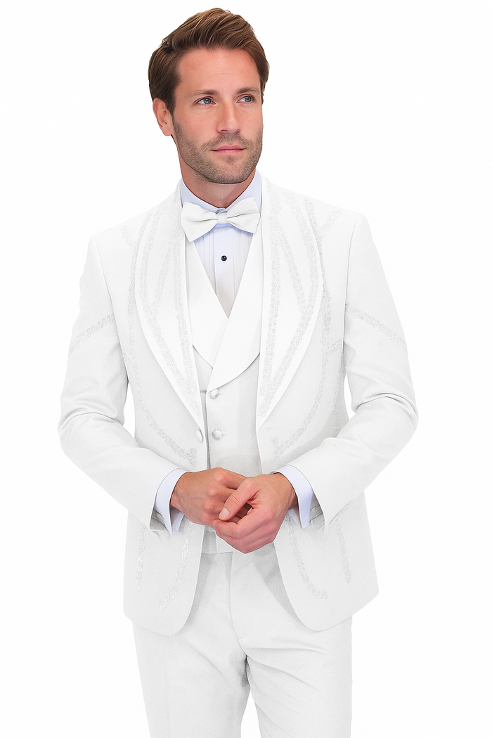 Modern fit Italian wool white tuxedo. Single-breasted jacket with peaked lapel, matching trousers, and vest. Smooth, tailored silhouette, subtle lapel detailing. Includes white bow tie and light blue shirt.

