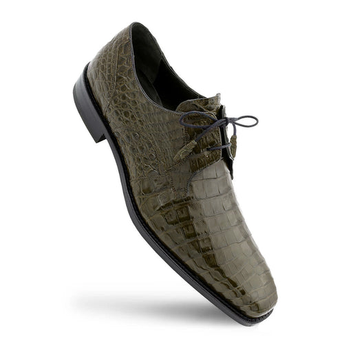 Olive green Mezlan Anderson derby shoes. Pointed toe, textured crocodile leather upper with a uniform scale pattern. Black sole, lace-up closure.

