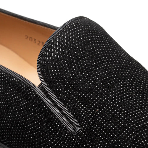 Mezlan Notte slip-on in black suede with raised dot texture. Features a sleek, rounded toe and stitched opening.
