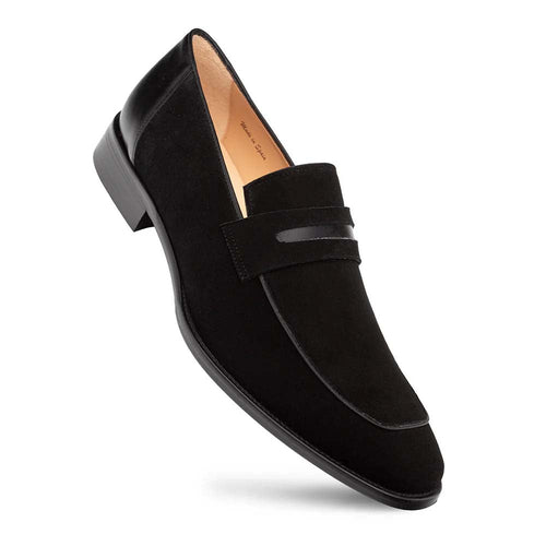 Sleek Mezlan Galeno penny loafer in black suede with a pointed toe. Features a smooth leather strap, low rectangular heel, and seamless suede/leather integration.
