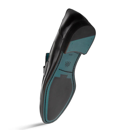 Mezlan Rios Flex Loafer in black: Smooth leather, elongated shape. Turquoise sole accent & flexible construction. Ornament detail adds structure.
