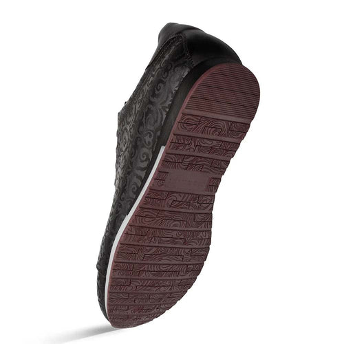 Mezlan Portico Laser Print sneaker in black. Low-profile, rounded silhouette. Textured upper with patterned design. Contrasting rubber sole with detailed tread.
